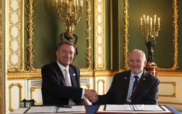 Sir Philip Craven, IPC President, and Patrick De Maeseneire signing the eight-year contract to jointly deliver the Athlete Career Programme to Paralympic athletes. 
Photo: Acecco Grpup